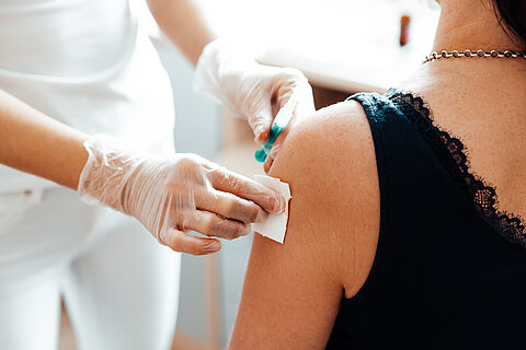 doctor-vaccinating-a-patient-against-covid-19-picjumbo-com.jpg